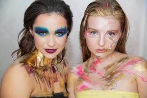 Two nice young women with creative make-up photo