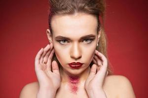 Pensive woman with makeup and hairdo photo