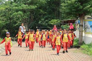Semarang, December 2022. Small children enjoy a trip to the Semarang Zoo with pleasure and enjoy. photo