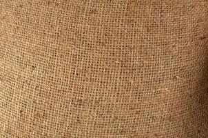 lienzo antiguo, tela de saco marrón, textura de tela beige vintage, para el fondo foto