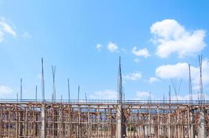 Construction site view of scaffolding poles on building site photo