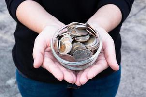 Coins in hands saving,Donation Investment Fund Financial Support Charity  Dividend Market  House Stock Trust Wealthy Giving Planned Accounting Collection Debt Banking ROI photo