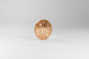 Golden bitcoin virtual coins on white background,Financial growth concept photo