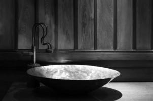 Retro style bathroom ,detail view of copper sink ,of retro design,Vintage bathroom decoration with faucet ,Monochrome photo