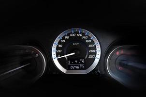 detail with the gauges on the dashboard of a car photo