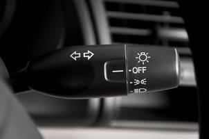 Car light switch control paddle on steering wheel photo