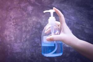 Hands holding with alcohol gel or antibacterial soap sanitizer .Hygiene concept. prevent the spread of germs and bacteria and avoid infections corona virus photo