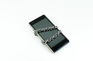Lock chain smartphone,Information security,Personal data security and protection concept - metal chain link with locked padlock on smartphone on white background photo