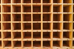 Empty wooden square shelves slots,Rectangular wooden block,Squares Blank wooden shelf. photo