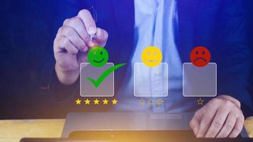 Businessman choosing happy smile face icon. feedback rating and positive customer review experience, satisfaction survey. mental health assessment. photo