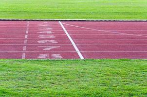 running track and green grass,Direct athletics Running track at Sport Stadium photo