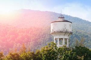 Cement water storage tank for Mountain and forest background photo