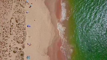 Drone flight over empty Gale beach in Portugal with top view on shoreline video