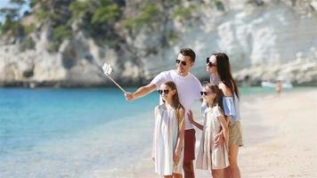 Young beautiful family taking selfie portrait on the beach video