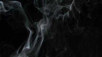 Slow motion of white smoke, fog, mist, vapor on a black background. video