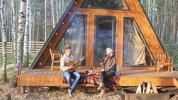 Happy family of two on the terrace in autumn video