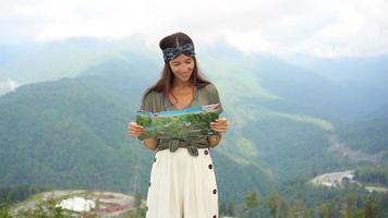 Happy young woman in mountains in the background of fog video