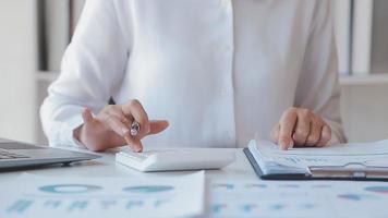 Financial analysts analyze business financial reports on a digital tablet planning investment project during a discussion at a meeting of corporate showing the results of their successful teamwork. video