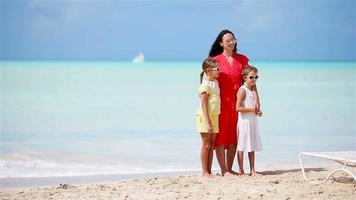 Mother with two kids enjoy beach vacation video