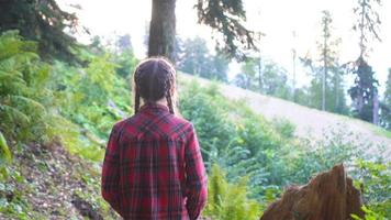 Beautiful happy little girl in mountains in the background of fog video