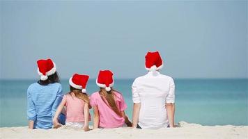 Happy family on the beach celebrating Christmas vacation video