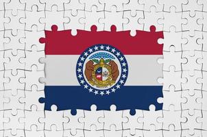 Missouri US state flag in frame of white puzzle pieces with missing central part photo