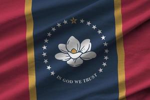 Mississippi new US state flag with big folds waving close up under the studio light indoors. The official symbols and colors in banner photo