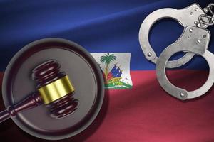 Haiti flag with judge mallet and handcuffs in dark room. Concept of criminal and punishment, background for judgement topics photo