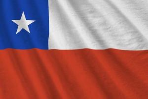 Chile flag with big folds waving close up under the studio light indoors. The official symbols and colors in banner photo