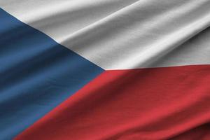 Czech flag with big folds waving close up under the studio light indoors. The official symbols and colors in banner photo