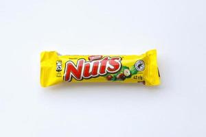 KYIV, UKRAINE - MAY 4, 2022 Nuts original chocolate bar manufactured by Nestle company photo