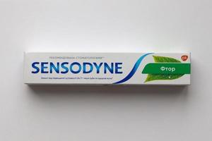 KYIV, UKRAINE - MAY 4, 2022 Sensodyne fluorine or fluor is a daily fluoride toothpaste photo