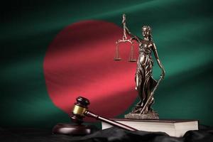 Bangladesh flag with statue of lady justice, constitution and judge hammer on black drapery. Concept of judgement and guilt photo