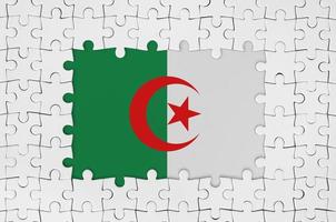 Algeria flag in frame of white puzzle pieces with missing central part photo