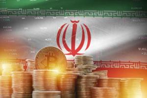 Iran flag and big amount of golden bitcoin coins and trading platform chart. Crypto currency photo