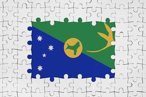 Christmas island flag in frame of white puzzle pieces with missing central part photo