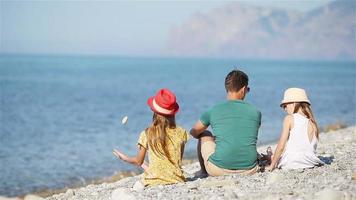 Happy beautiful family on a tropical beach vacation video