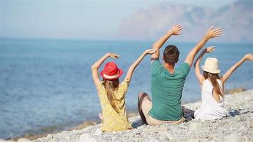 Happy beautiful family on a tropical beach vacation video