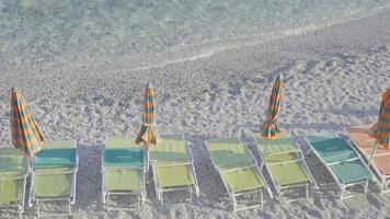 Sunbeds and umbrellas at beautiful european seashore in Monterosso in Italy, Cinque Terre, Liguria video