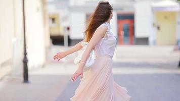 Portrait of happy young urban woman outdoors. Caucasian tourist enjoy warm summer day outdoors. video