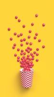 Red coated chocolate candies scattered out of the paper cup with red zigzag pattern on yellow background. 3d rendering. photo