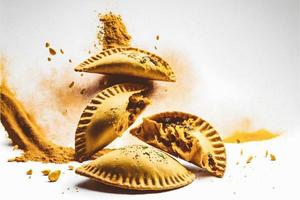 Bring a touch of sophistication to your food-related projects with our Empanadas on a white background. Showcase the rich flavors and diversity of Latin American cuisine photo