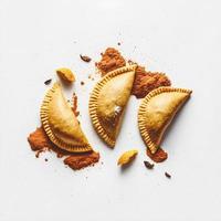 Bring a touch of sophistication to your food-related projects with our Empanadas on a white background. Showcase the rich flavors and diversity of Latin American cuisine photo