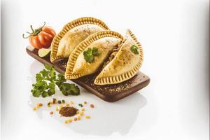 Bring a touch of sophistication to your food-related projects with our Empanadas on a white background. Showcase the rich flavors and diversity of Latin American cuisine photo