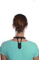 Smart posture corrector on shoulders,  white background photo