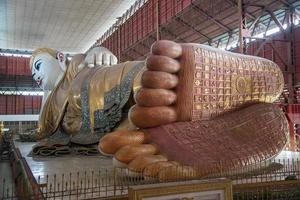 Kyauk Hhat Gyi the big reclining Buddha with beautiful eyes, one of famous attraction place in Yangon township of Myanmar. photo