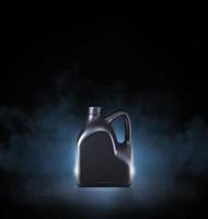 Black bottle of engine oil on black background with smoke photo