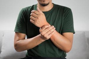 A man sprained wrist symptoms and arthritis in the wrist photo