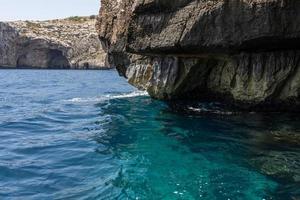 beautiful view of the rock in the sea in Malta. water of turquoise and blue photo