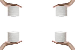 Close-up of a woman hand using toilet paper isolated on a white background. Hand holding roll of tissue paper. white roll toilet paper on female hand. photo